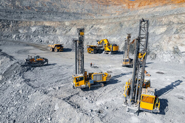 Industry Open coal mine, Drilling machine borer installing cast explosives blasting