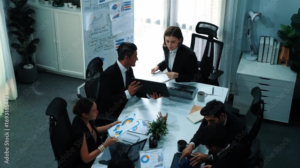 Poster top view of smart manager looking at financial statistic on tablet at meeting room. group of diverse