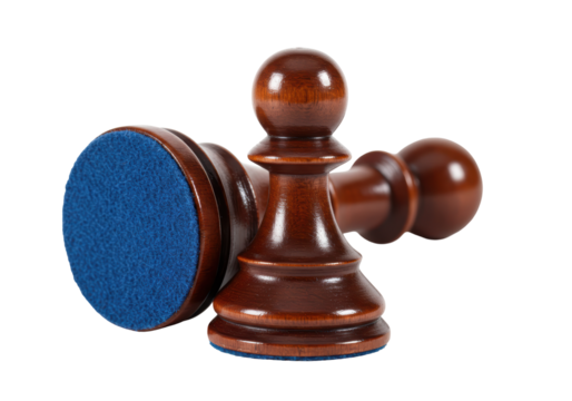 Isolated wooden pawns from a chess set laying on their sides, awaiting a new game to begin