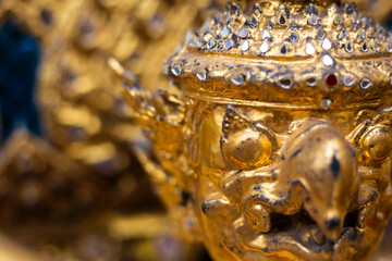 Golden bright details of an ancient Grand Palace Temple in Bangkok, Thailand