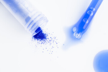 Close up of Blue Copper Peptides in Powder and Liquid Form