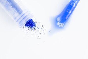 Close up of Blue Copper Peptides in Powder and Liquid Form