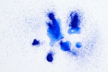 Close up of Blue Copper Peptides in Powder and Liquid Form