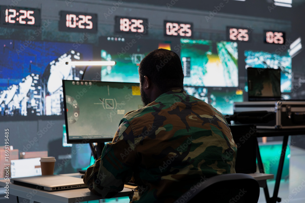 Poster air defense division operative using radar on computer to detect ballistic missiles. army soldier in