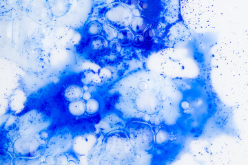 Close up of Blue Copper Peptides in Powder and Liquid Form