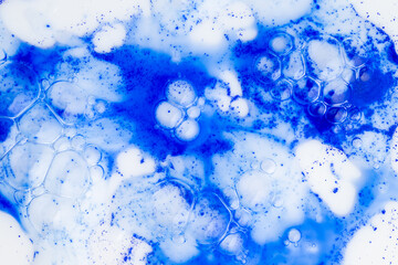 Close up of Blue Copper Peptides in Powder and Liquid Form