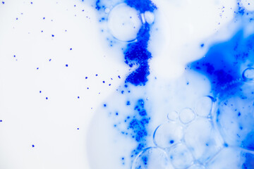 Close up of Blue Copper Peptides in Powder and Liquid Form