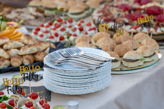 White Plates with Cutlery and Served Food – Pre-Birthday Party Catering Setup