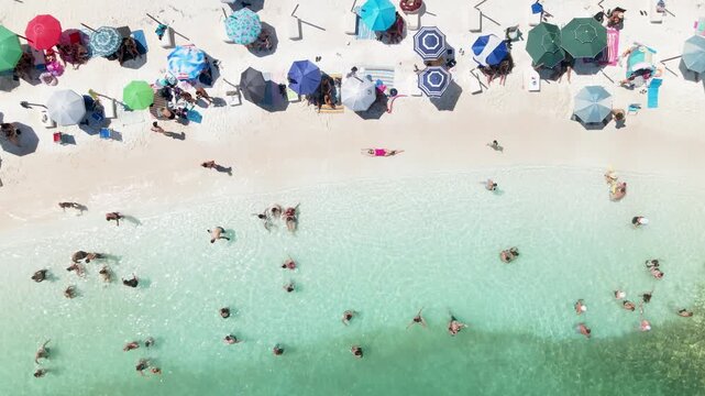 Woman on Porto Vathy Beach, Thassos Island, Greece. . Amazing beach with clear blue water. Aerial panoramic drone view from above, top view from drone. Summer holidays Europe
