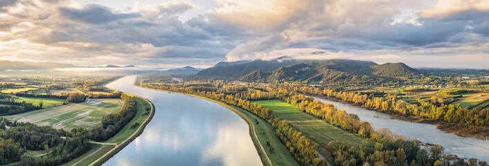 Sunrise Landscape over Rhone River in France with Mountains, Fields and Scenic Nature, Aerial View of Serene Countryside at Dawn