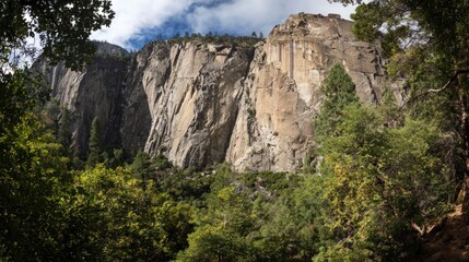 Naklejka premium Massive mountain cliffs and forest