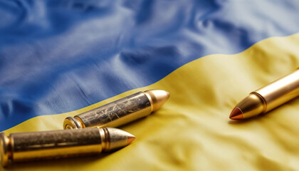 Ammunition placed on Ukrainian. Gold bullets on blue textile with yellow stars, representing militarization, defense spending and growing security concerns in Ukraina