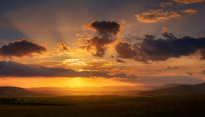 Fototapeta premium Golden Sunset Breaks Through Clouds Over A Tranquil Landscape Casting Warm Hues And Creating A Serene Atmosphere During Dusk