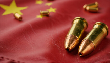 Two large bullets and scattered shell casings rest on a wrinkled Chinese flag. The scene symbolizes armed conflict, geopolitical tension in Asia, and military crisis in China