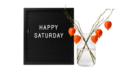 Black Letter Board with Happy Saturday Message Orange Lantern Plants in Vase.