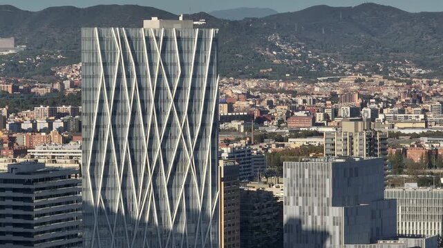 sunny evening barcelona city modern bay office buildings exterior aerial panorama 4k spain