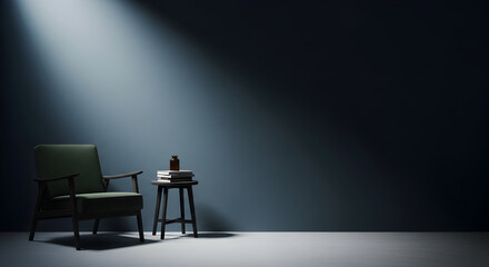 Armchair and books in a dark room illuminated by a spotlight creating a moody and atmospheric interior scene perfect for contemplation and relaxation