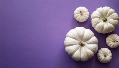 Aesthetic Arrangement Of White Pumpkins On Vibrant Purple Background For Autumn Harvest Theme