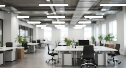 Fototapeta premium Minimalist and Modern open space business office interior without people with blurred bokeh light background. tables, chairs, computers . copy space. green office concept