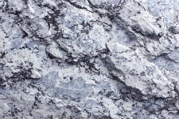 Obraz premium Close-up of textured grey-white rock face
