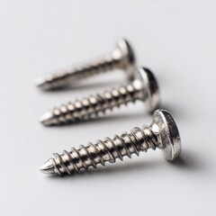Closeup metal screw (bolt) and nuts on white background.