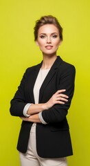 Obraz premium Confident Young Woman Wearing Black Blazer and White Top Standing in Bright Yellow Background