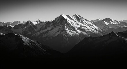 Obraz premium a black and white photo of a mountain range