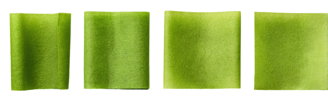 Four square swatches of a light yellowish-green hue,  showing a gradual gradient or shading effect