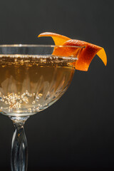 glass of champagne, cocktail with fancy orange twist