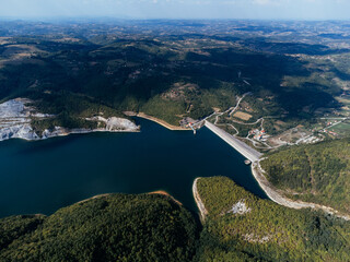 Aerial view of Rovni Lake reservoir and surrounding hilly landscape in Serbia. g.