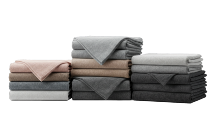 Stacked towels in various colors on a white background with softness concept  