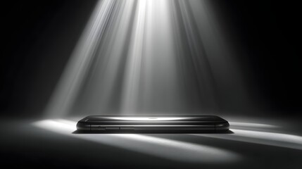 A sophisticated smartphone is highlighted by dramatic spotlights in a minimalist presentation.