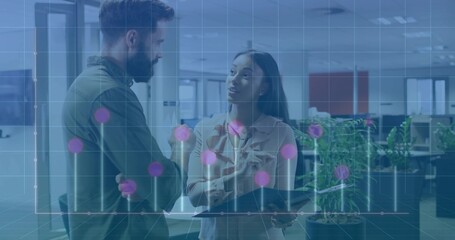 Two colleagues in shirt and blouse discussing data in office, with tablet and stylus, graph overlay