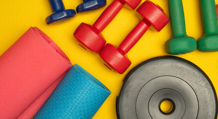 colored background with fitness accessories