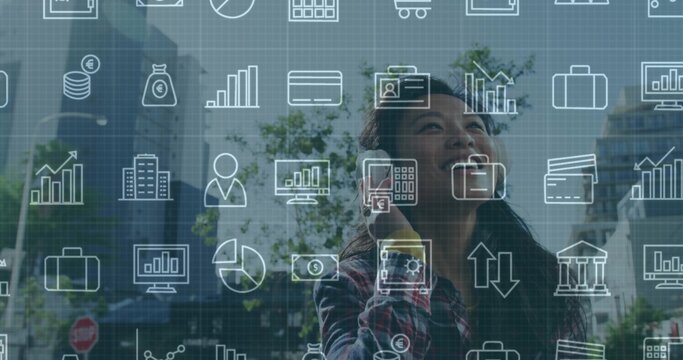 Talking Asian businesswoman holding smartphone in plaza, with floating finance icons, copy space