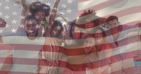 Cheering eight friends wearing sunglasses on sandy beach, with American flag graphic overlay