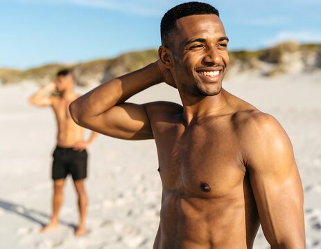 Smiling man on beach, toned physique