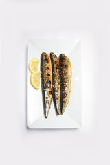 Traditional Korean Grilled Pacific Saury Fish (Ggongchi Gui) on White Background – Authentic Asian Cuisine, Healthy Seafood Dish