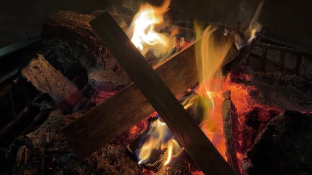 utting wood in the fireplace to burn on a cold winter night.