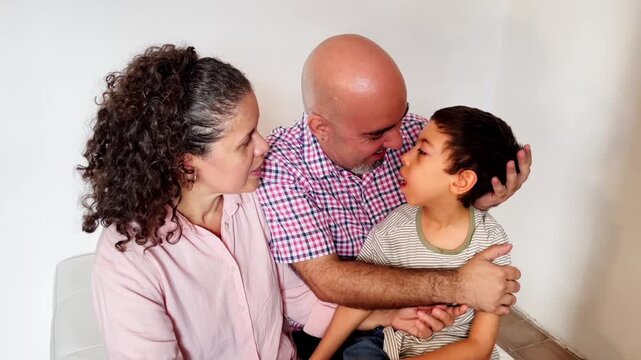 A joyful family moment with a smiling boy with disabilities