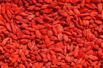 Texture of red dried goji berries as background