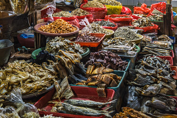 Fototapeta premium Assorted Dried Fish Display at Traditional Market
