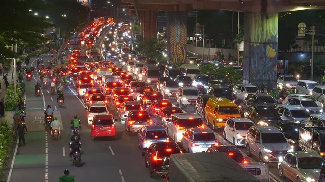 night time jakarta city center rush hour traffic street road overpass bridge top panorama 4k indonesia 