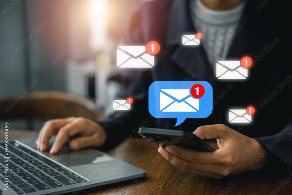 Poster person using smartphone and laptop with email notifications, symbolizing modern digital communicatio