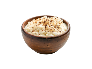 wooden bowl filled with creamy rice pudding sprinkled with cinnamon