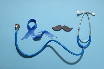 Stethoscope, blue ribbon, and mustache for awareness