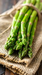 Fresh asparagus bunch on burlap