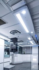 Modern, bright interior with ceiling lighting and HVAC