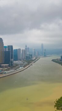 day time zhuhai macau construction riverside bay aerial vertical panorama 4k timelapse china 
