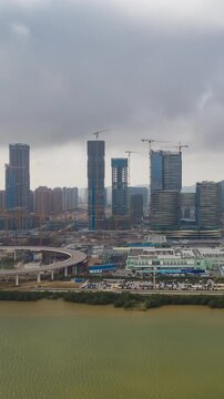 day time zhuhai city mega construction bay macau city aerial vertical panorama 4k timelapse china 